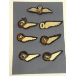 A New Zealand Air Force pilot's cloth wings and six other various cloth wings including Observer,