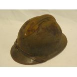 A Second War Adrien-pattern steel helmet with liner and chin-strap