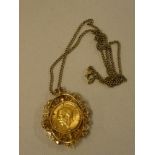 A 9ct gold pendant necklace with floral and pierced decoration inset with a 1912 gold sovereign