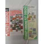 A Stanley Gibbons Commonwealth and British Empire stamp catalogue 2017 and two others