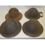 Four various Second War Home Service steel helmets