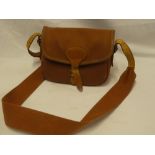 A good quality Brady leather and canvas shotgun cartridge bag with strap