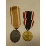 A Second War German West Wall medal and a German 1939 Service medal (2)