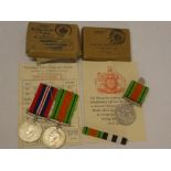 A Second War Defence medal and 1939-45 War medal with Army slip in original box and a Second War