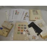 Various album pages and packets of British Empire and Commonwealth stamps together with postal