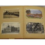 An album of various black and white and coloured postcards - Foreign views, figures etc.