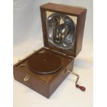 A small Decca Junior table top gramophone in brown fibre case