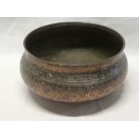 A 19th century Middle Eastern copper circular bowl with engraved decoration,