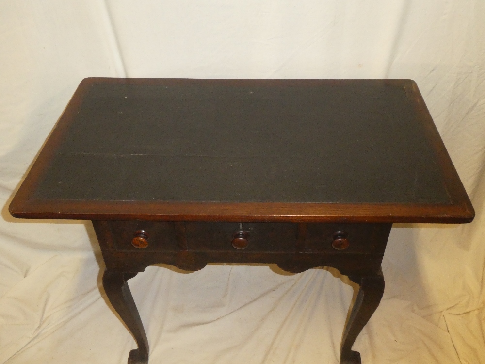 A George III mahogany and stained wood low boy with three drawers in the frieze on cabriole legs - Image 2 of 2