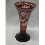 A good quality Bohemian cut ruby-tinted glass tapered vase decorated with foliage and buildings,