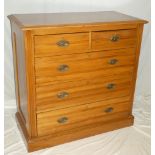 A late Victorian polished satin walnut chest of two short and three long drawers with brass ring