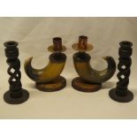 A pair of turned wood spiral twist candlesticks,