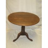 A 19th century mahogany circular snap-top occasional table on turned column with tripod base