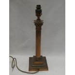 A copper Corinthian column table lamp with square base,