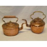 A mid-19th century copper circular kettle with brass scroll handle and one other copper oval kettle