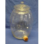 An old glass barrel and cover with base tap aperture,