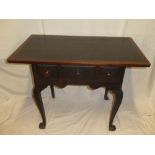 A George III mahogany and stained wood low boy with three drawers in the frieze on cabriole legs