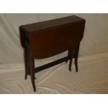 An Edwardian walnut rectangular Sutherland-style drop-leaf tea table on square shaped legs