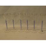 A set of six good quality liqueur goblets with blue and white air twist stems on circular bases,