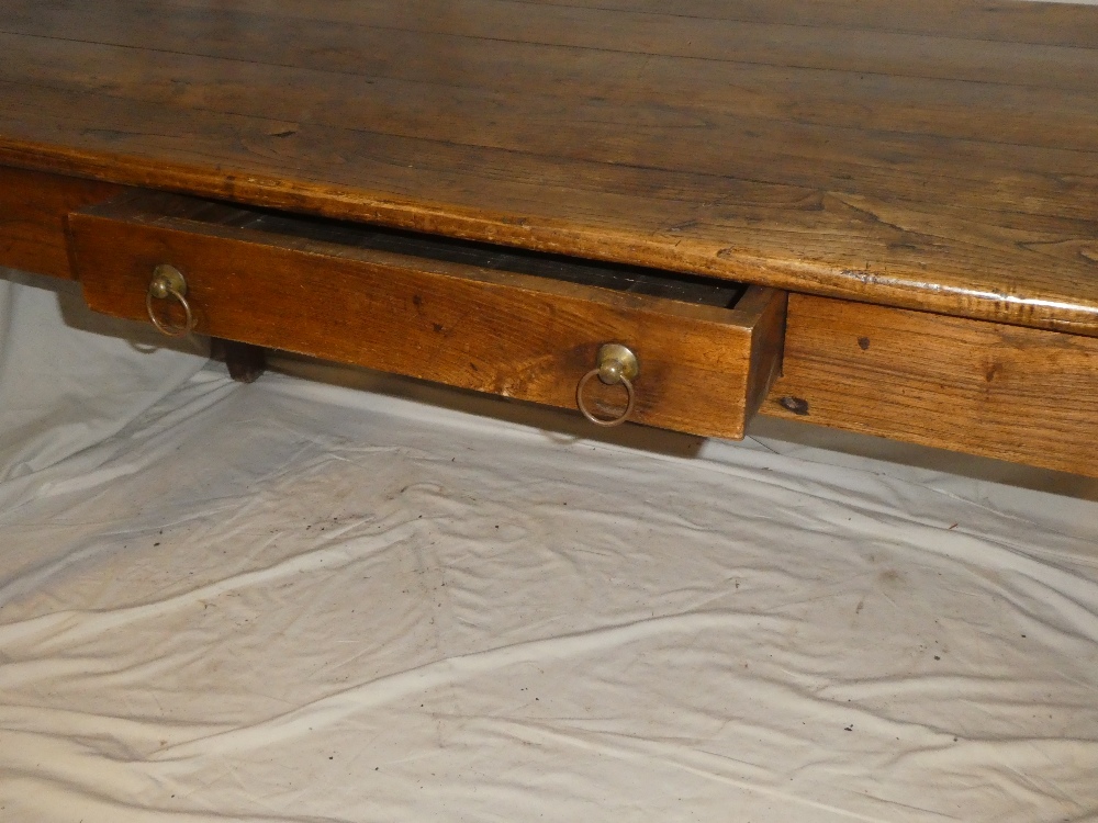 A 19th century polished elm kitchen table with a pull-out slide in one end opposing a single end - Image 3 of 5