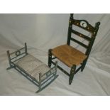 A child's painted wood chair with string work seat and a painted beech wood miniature cot (2)