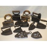 A selection of various old box irons and flat irons together with two various iron trivets,