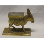 An unusual brass novelty cigarette dispenser in the form of a donkey