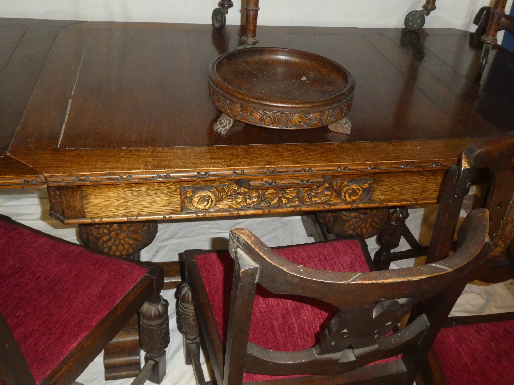 An unusual 1930/40's suite of carved oak matching dining and lounge furniture comprising a - Image 6 of 6