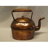 A 19th century copper rectangular kettle with strap handle