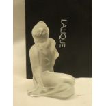 A Lalique glass figure of a seated nude female, 4¾" high, signed Lalique France,