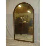 A 19th century arched over mantel mirror in gilt leaf painted frame,