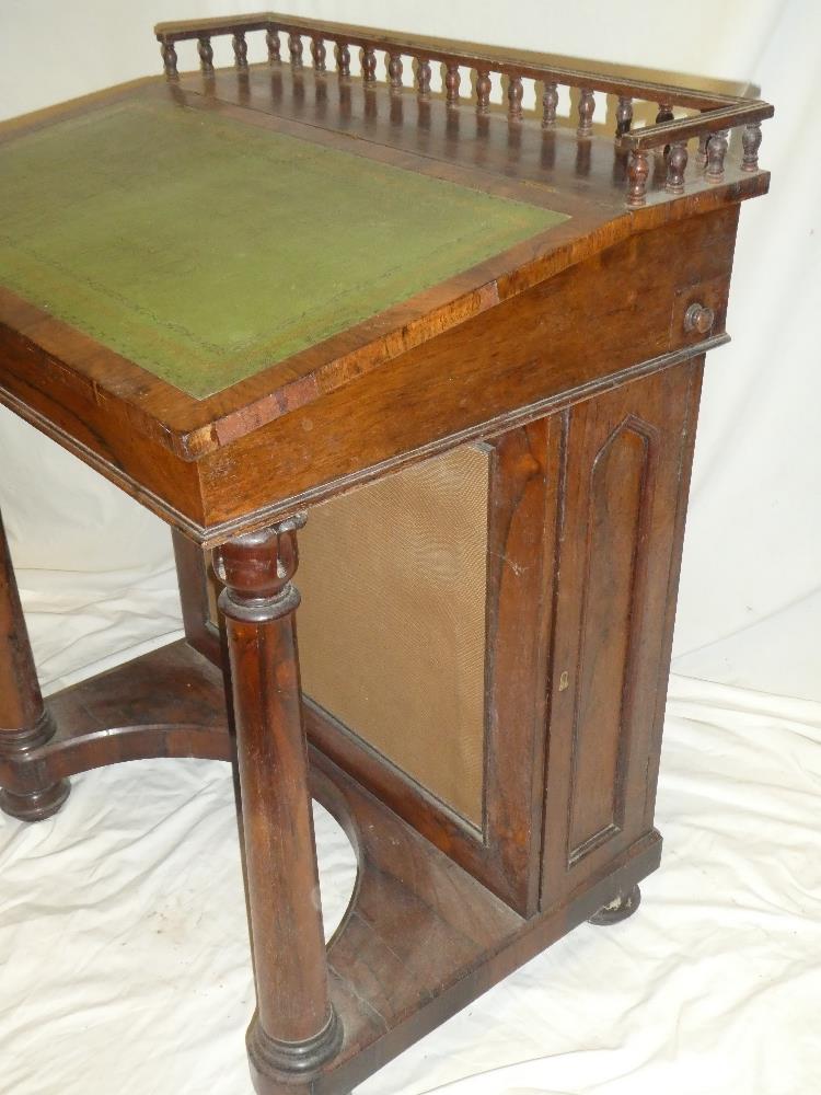 A Victorian rosewood Davenport desk with pigeon holes enclosed by a hinged sloping writing surface, - Image 2 of 2