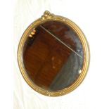 A bevelled circular wall mirror in gilt circular frame 20" diameter