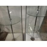 A pair of good quality modern glass display cabinets with central circular shelves and sliding