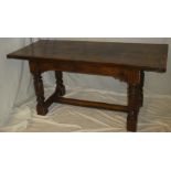 An early elm and oak rectangular refectory dining table with figured rectangular top,
