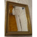 A good quality bevelled rectangular wall mirror in ornate gilt frame,