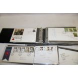 An album containing a selection of over 60 various GB first day covers,