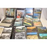 Seven albums of various postcards,