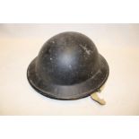 A Second War Home Service helmet with liner and chin strap