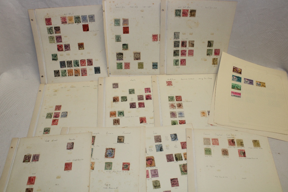 Various album pages containing a collection of British Commonwealth stamps,