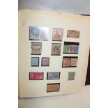 An album containing a collection of India and Indian States stamps