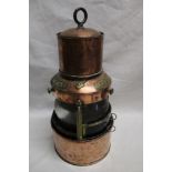 An old hanging ship's copper cylindrical lamp by G. W.