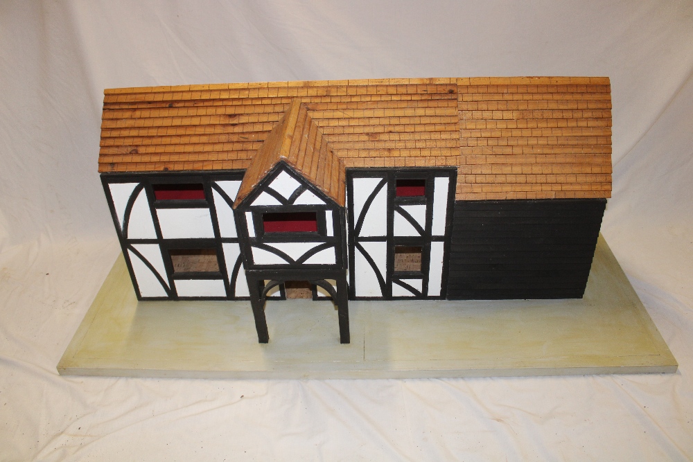 A good quality wooden constructed two storey meeting house/doll's house on rectangular base,