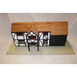 A good quality wooden constructed two storey meeting house/doll's house on rectangular base,