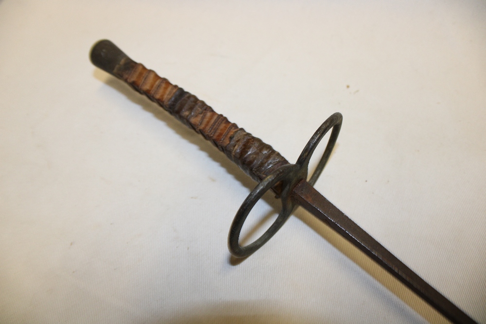 An old fencing sword with brass guard and leather grip (af)