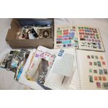 Two albums of various GB and World stamps together with a selection of various postcards,