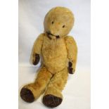 An old plush covered straw filled teddy bear 20" long (af)