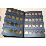 An album containing a collection of EIIR coins including shillings, halfpennies, 3d coins etc.