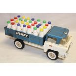 A Tri-ang Hi-way milk lorry complete with milk bottles