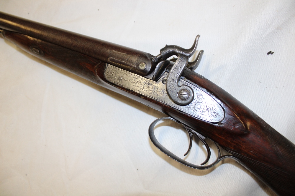 A 19th century 12bore double barrel percussion sporting gun by W Richards with 29" Damascus barrels,